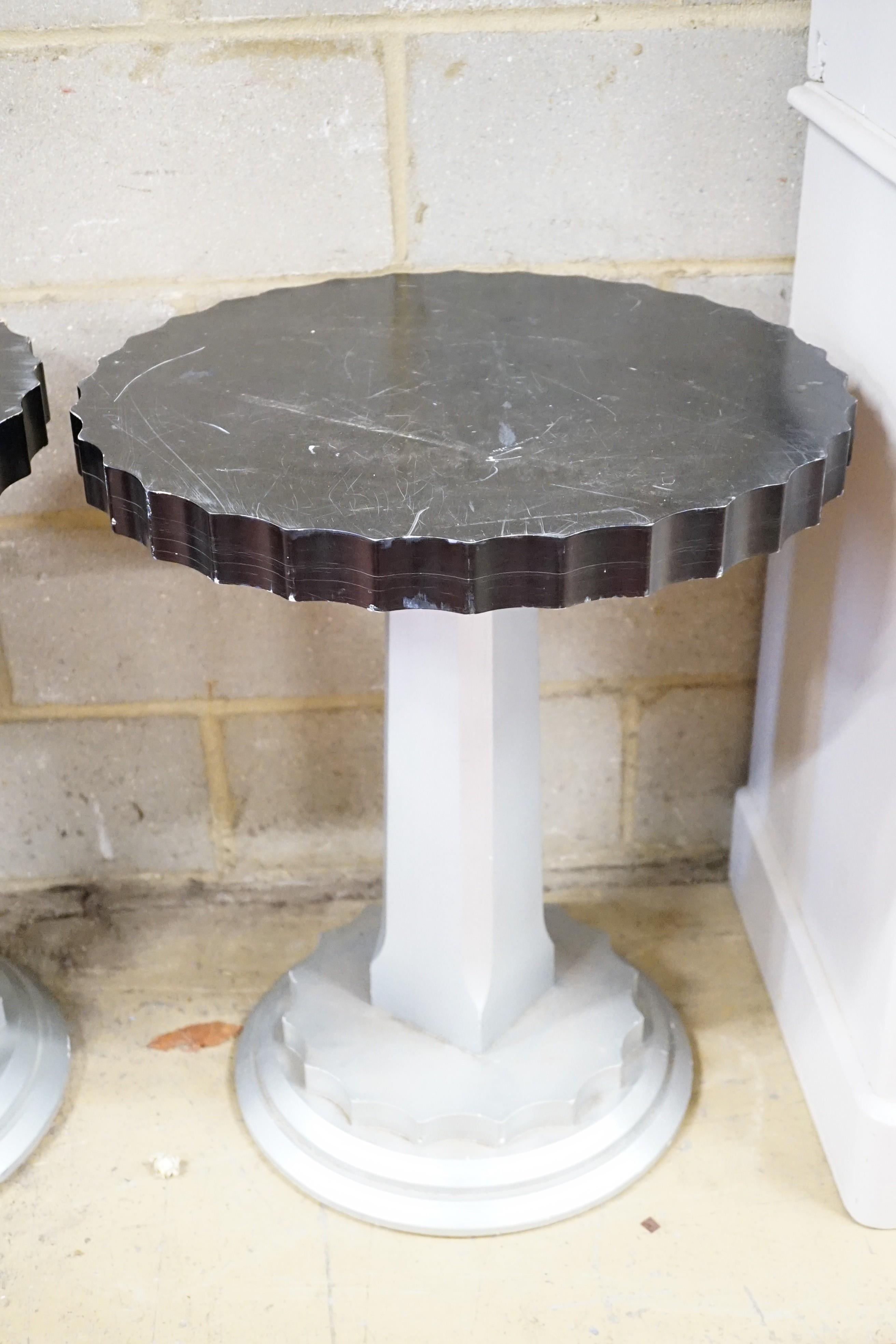 A pair of Art Deco ebonised and silvered wood occasional tables, diameter 60cm, height 71cm